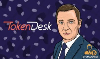 A portrait of Vilnius mayor Arturas Zuokas with a dark, blue background, the logo of TokenDesk is also visible, as Arturas Zuokas joins the advisory board