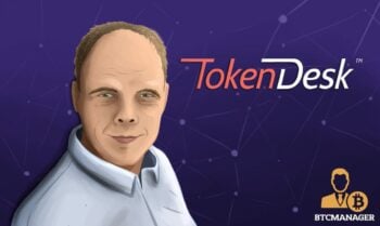 A portrait of Token Desk CEO Gintaras Tamosuinas with the Token Desk logo in the background