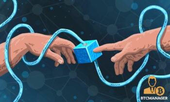 two hands touching a blue blockchain block