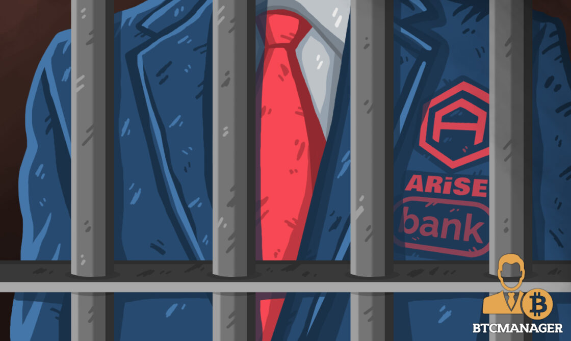 man in red tie behind bars
