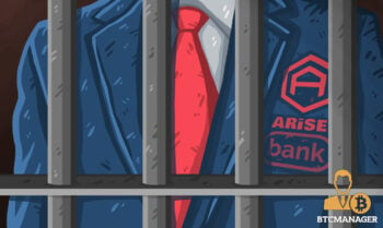 man in red tie behind bars