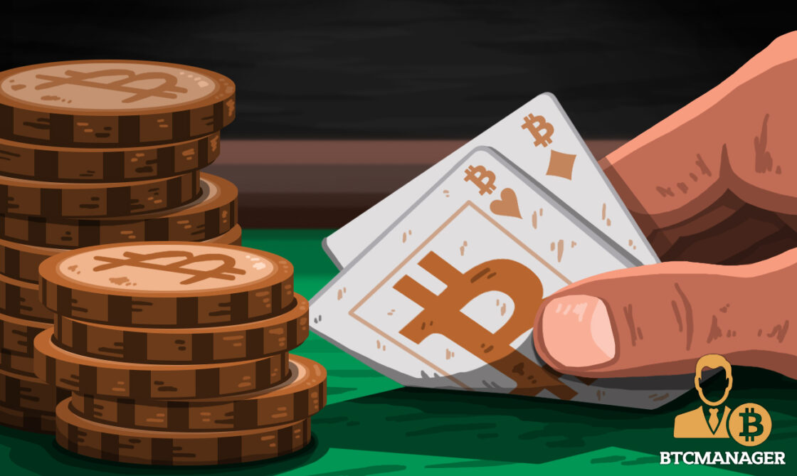 cards on table with bitcoin chips