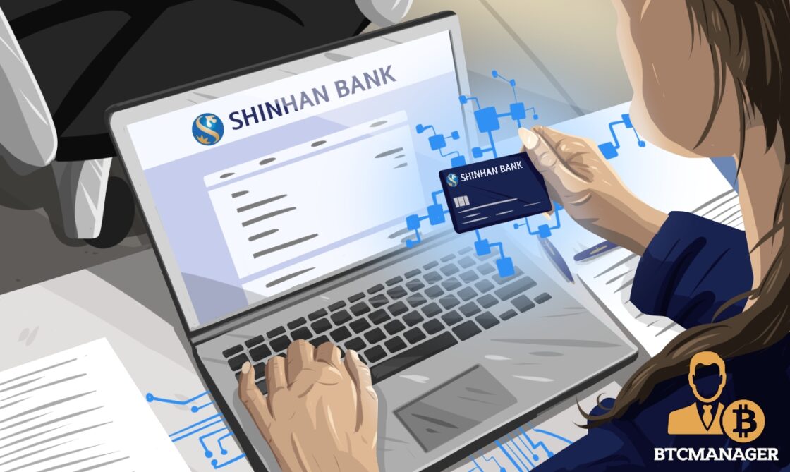 Person Checking Laptop with Shinhan Bank Card