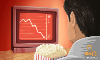 Man Eating Popcorn Watching the Market Fall
