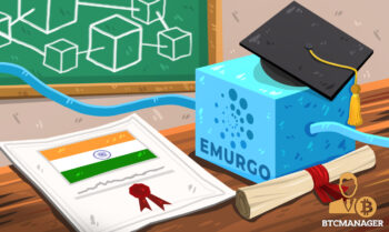 Emurgo Block Sitting on a Desk Next to a Certificate