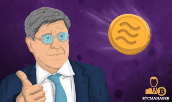 Man in Glasses Looking at a Libra Coin