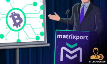 Man Standing at a Podium Looking at a Matrixport Logo