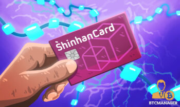 Hand Holding a Shinhan Card