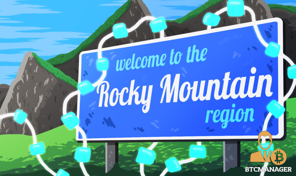 A rocky mountain sign covered in blue blockchains