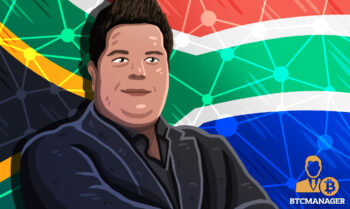 Monero Core Team Member standing infront of South Africa flag