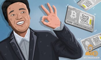 Bobby Lee looking happy next to hardware metal bitcoin wallet