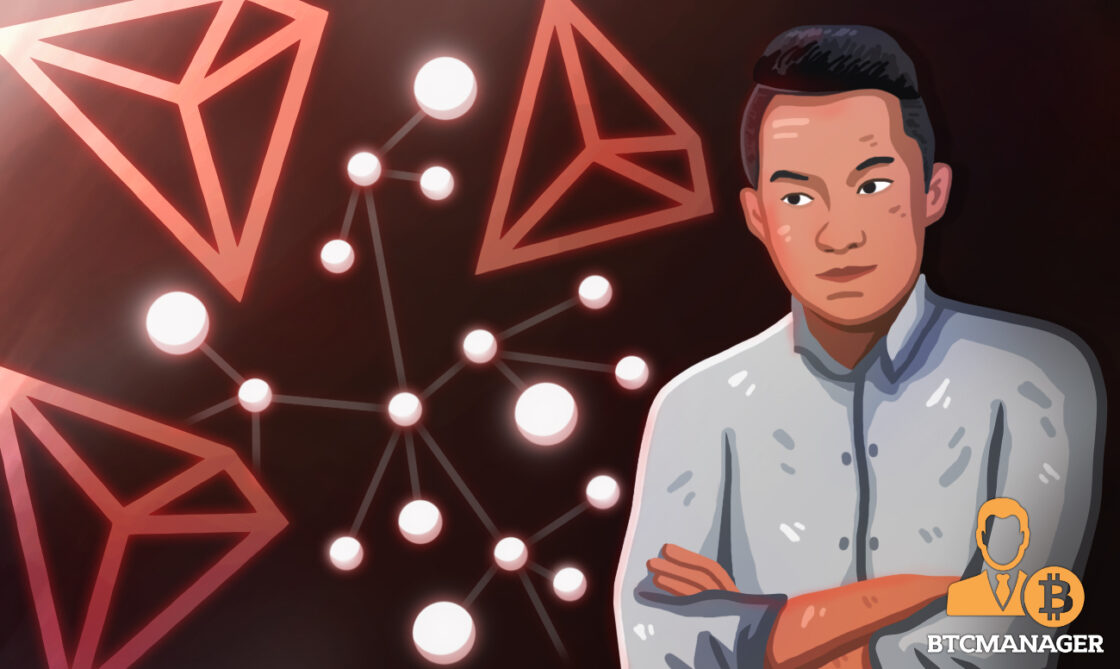 justin sun in front of lights and tron